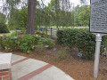 A view of the landscaping on the right, front of the synagogue, showing the specific location of each memorial marker.
