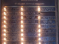 A close-up view of the yahrzeit plaque on the left side of the left wall of the sanctuary.