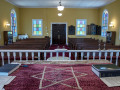 A view of the sanctuary, looking from the pulpit at the front of the sanctuary toward the back wall of the sanctuary.
