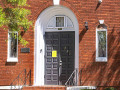 A close-up view of the front door of the synagogue, looking from Screven Street toward the synagogue.