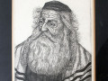 A close-up view of the signed and numbered, black and white drawing of a rabbi, on the right wall of the library.