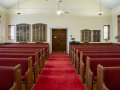 A view of the sanctuary, looking from the front of the sanctuary toward the back of the sanctuary.