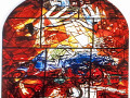 A close-up view of the middle stained glass panel in the bottom row of the stained glass artwork on the left wall of the sanctuary.