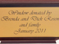 A close-up view of the plaque on the window ledge of this window.