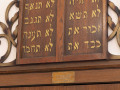 A close-up view of the Ten Commandments at the top of the Ark.