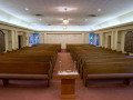 A view of the sanctuary, looking from the front of the sanctuary toward the back of the sanctuary.