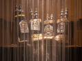 A close-up view of the Torahs behind the curtain of the ark.