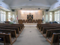 A view of the sanctuary, looking from the back of the sanctuary toward the front of the sanctuary. The closed Ark and Eternal Flame are visible on the bimah.