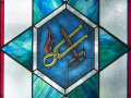 A close-up view of the middle panel of this stained-glass window.