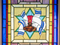 Eternal flame stained glass window and plaque, right side of sanctuary, 2nd window from the back.