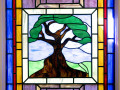 Tree of Life stained glass window, right side of sanctuary, 5th window from the back.