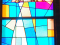 A close-up, full length view of the stained-glass window on the front wall of the sanctuary, to the left of the ark. A close-up view of the stained-glass window on the front wall of the sanctuary, to the left of the ark.