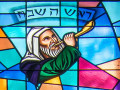 A close-up view of the top panel of the stained-glass window on the front wall of the sanctuary, to the right of the ark.