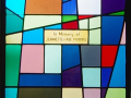 A close-up view of the inscription on this stained-glass window.