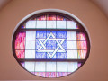 A close-up view of the stained-glass window above the ark.