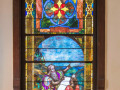The fourth stained glass window on the left side of the sanctuary.