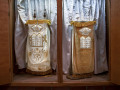 A close-up view of the two Torahs and the shofar in the open ark.